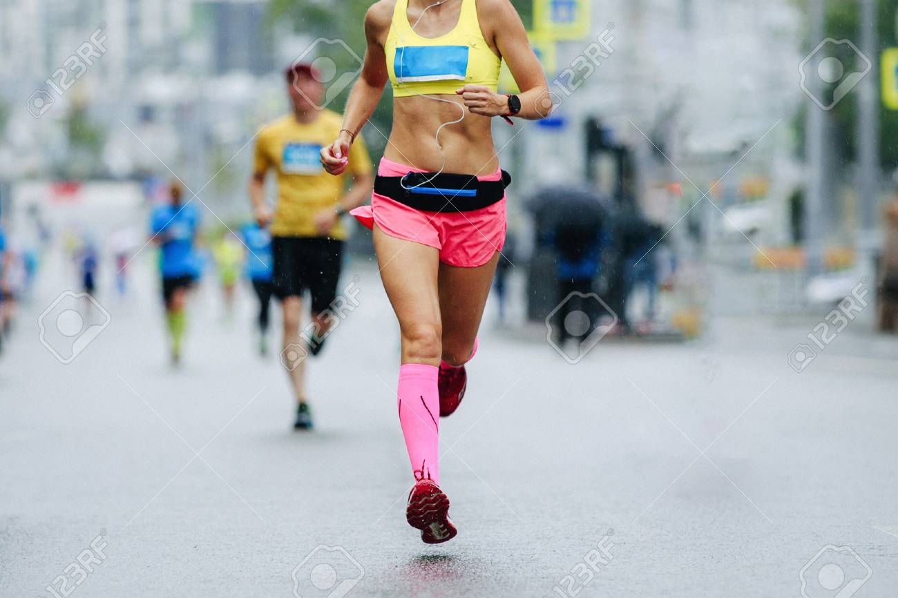 Woman Runner Running City Marathon Race In Rain Stock Photo Picture And Royalty Free Image Image 122201345