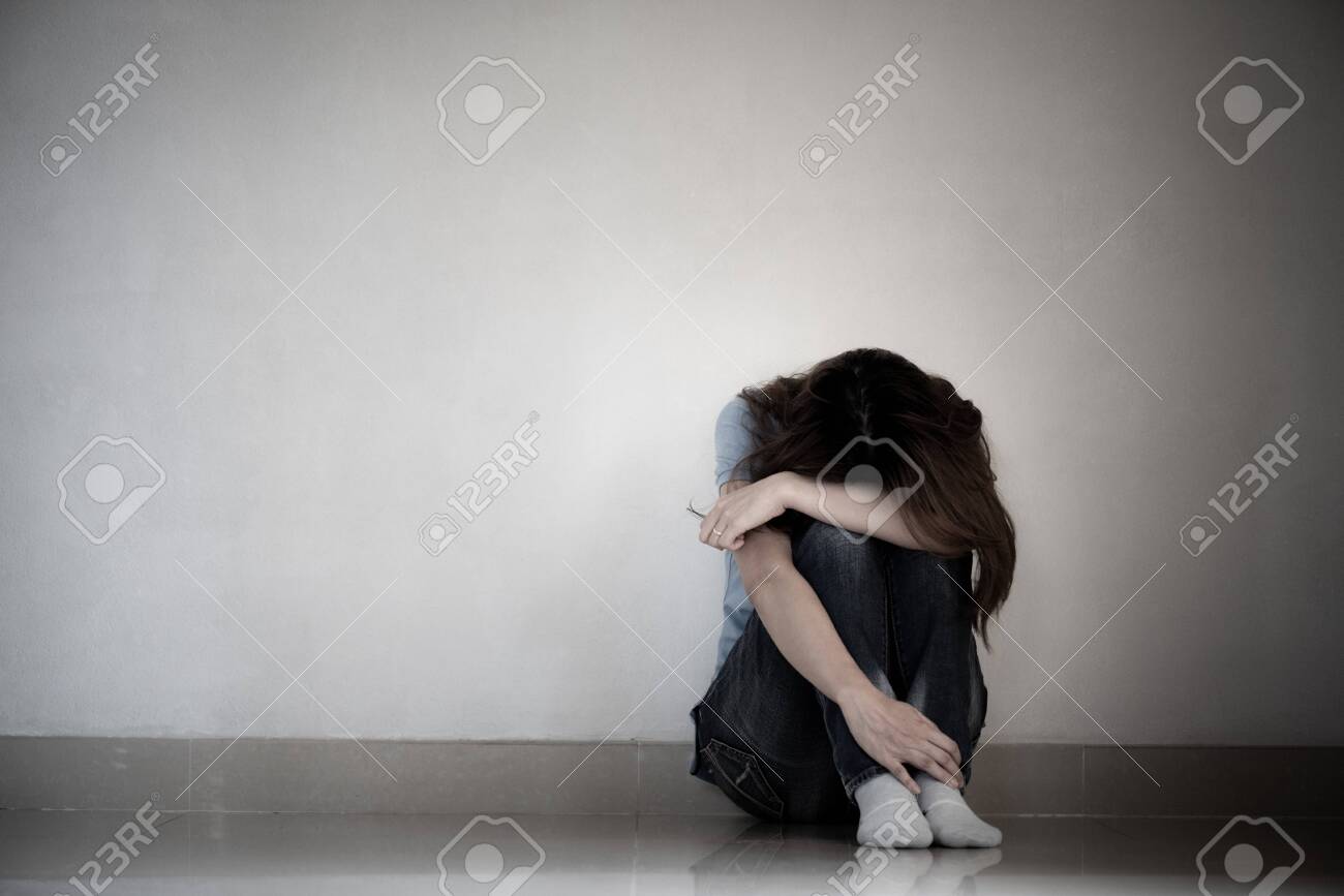 Sad Woman Hug Her Knee And Cry. Sad Woman Sitting Alone In A Empty Room.  Stock Photo, Picture and Royalty Free Image. Image 130210522., image size:1300x867