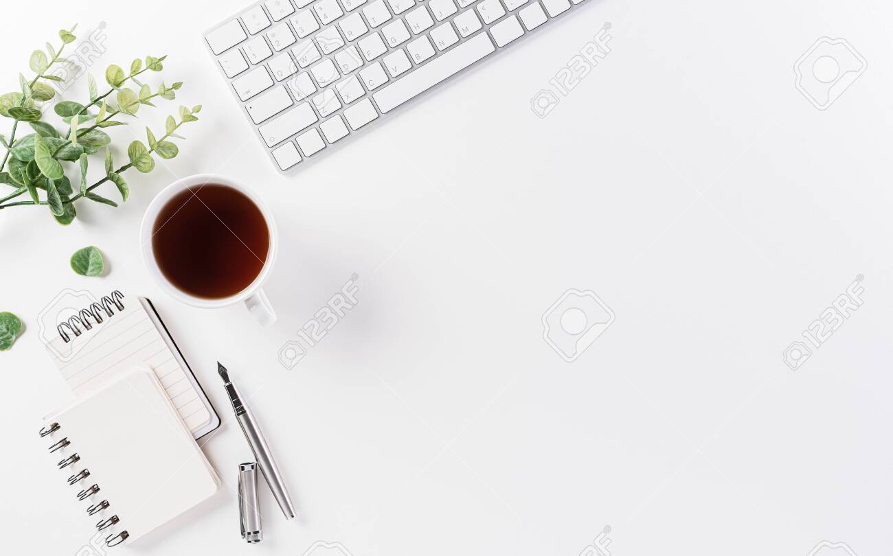 Flat Lay, Top View Office Table Desk. Workspace With Keyboard, Office  Supplies, Pencil And Coffee Cup With Copy Space On White Background. Stock  Photo, Picture and Royalty Free Image. Image 153939912., image size:1300x810