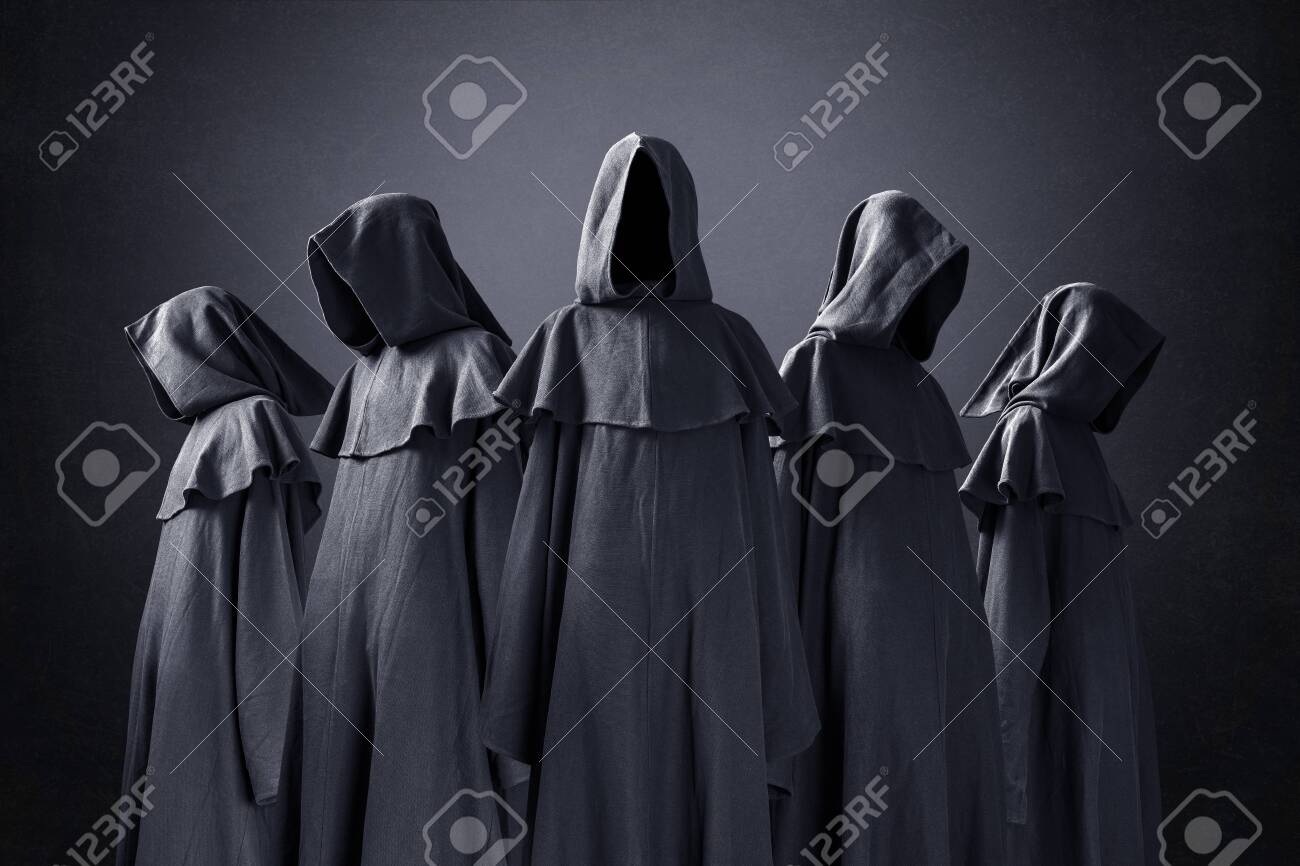 Group Of Five Scary Figures In Hooded Cloaks In The Dark Stock Photo,  Picture And Royalty Free Image. Image 157412957.