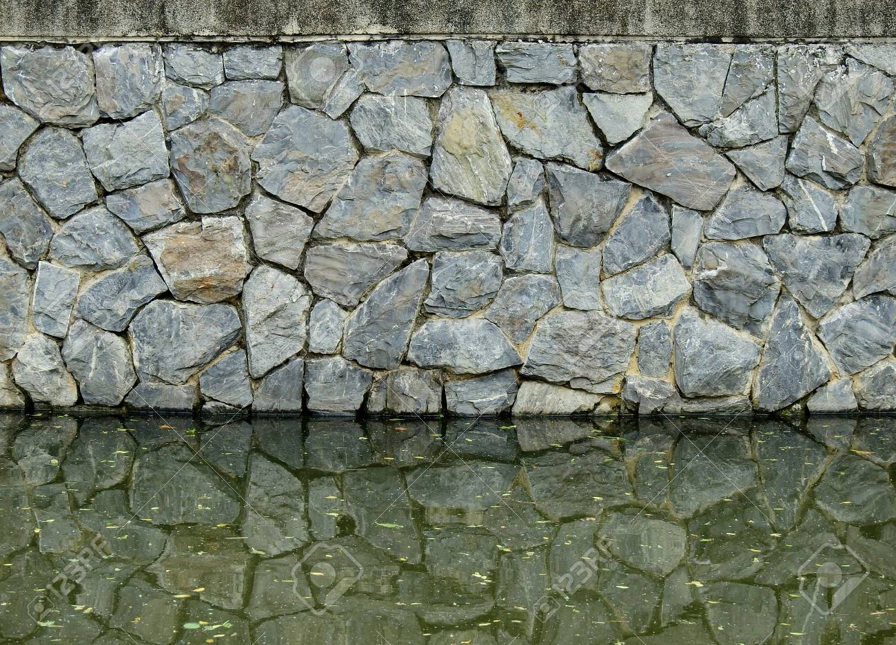 stone water wall on Old Stone Wall With Water Reflection In The Pond Stock Photo Picture And Royalty Free Image Image 93651088