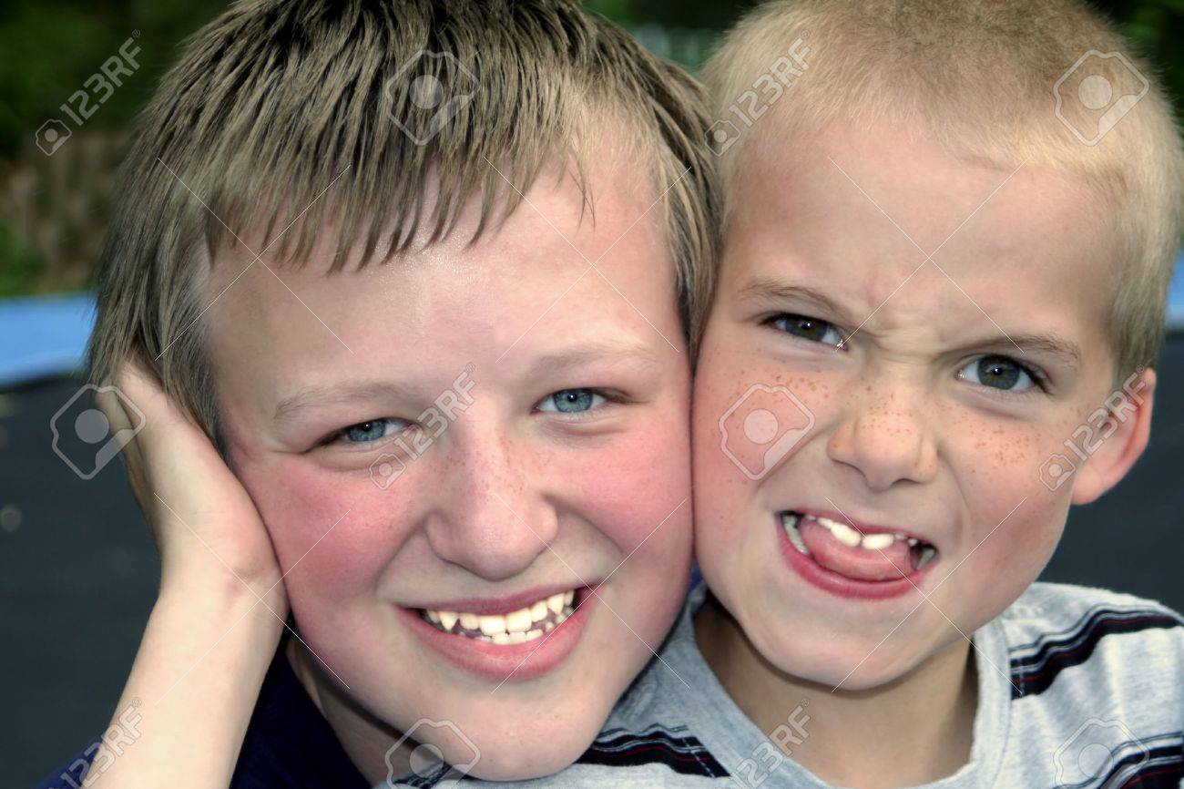 Portrait Of Two Boys, One Smiling, One Making A Funny Face. Stock Photo, Picture And Royalty Free Image. Image 538635. Portrait Of Two Boys, One Smiling, One Making A Funny Face. Stock Photo, Picture And Royalty Free Image. Image 538635.
