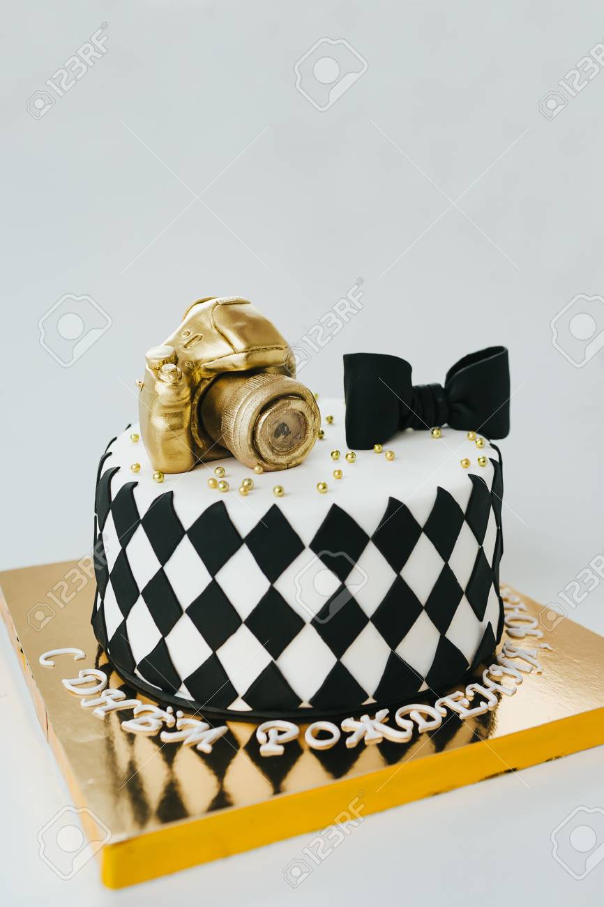 black and white birthday cake for photographer on white background