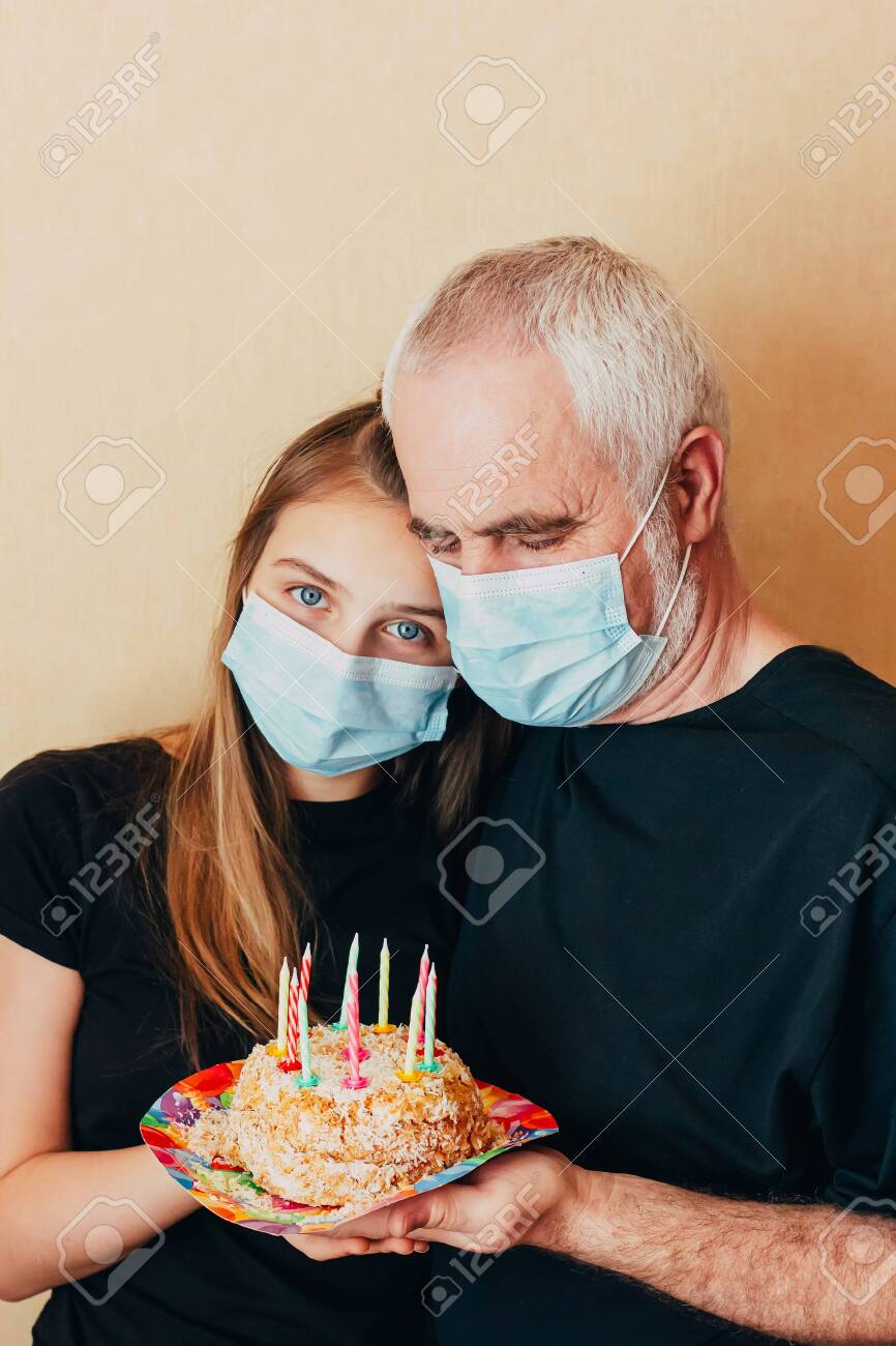 Download Grandfather And Granddaughter In A Protective Mask Are Holding Stock Photo Picture And Royalty Free Image Image 144174701