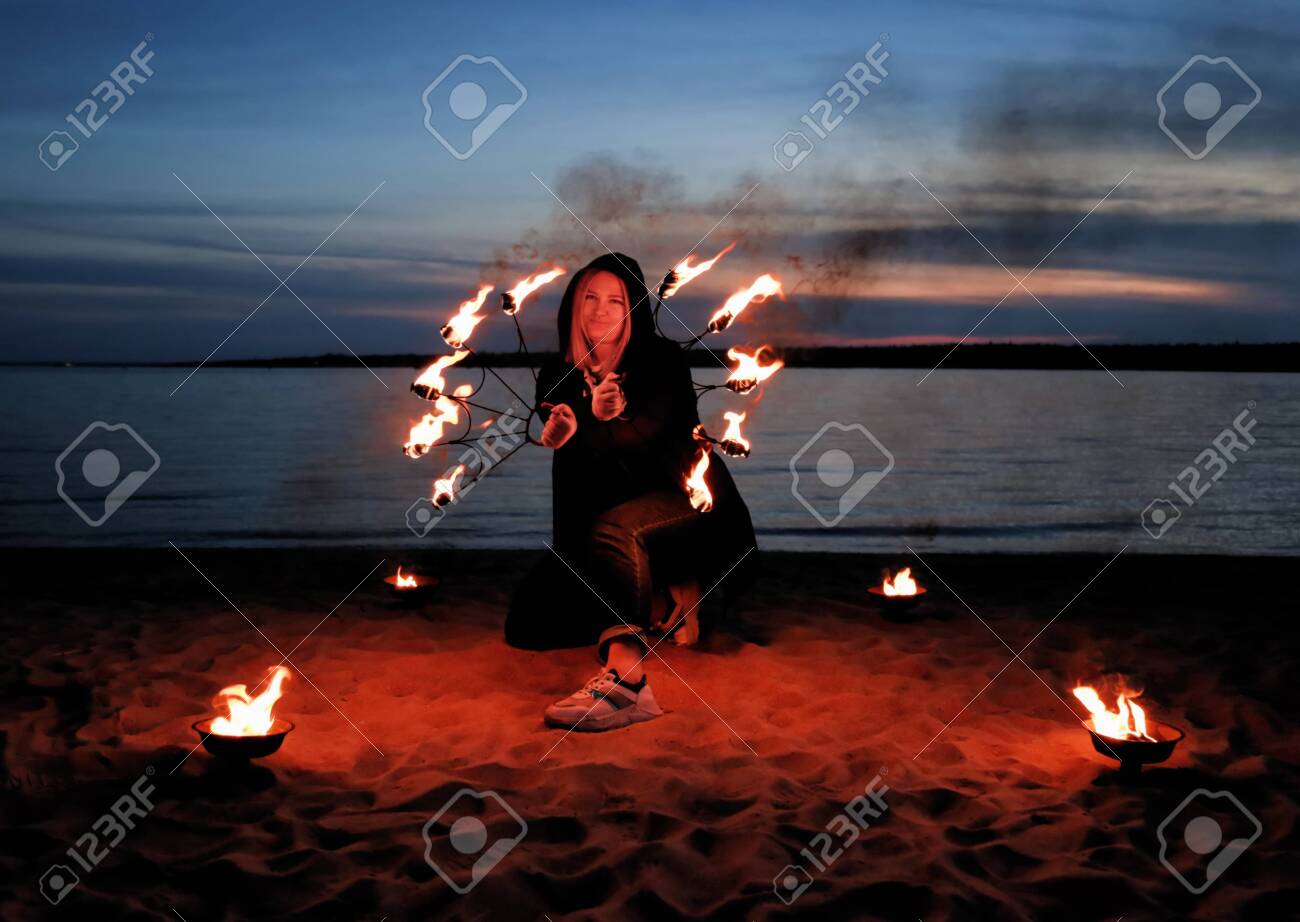 Young Girl By The Sea Shows A Show With Fire Details For Working Stock Photo Picture And Royalty Free Image Image