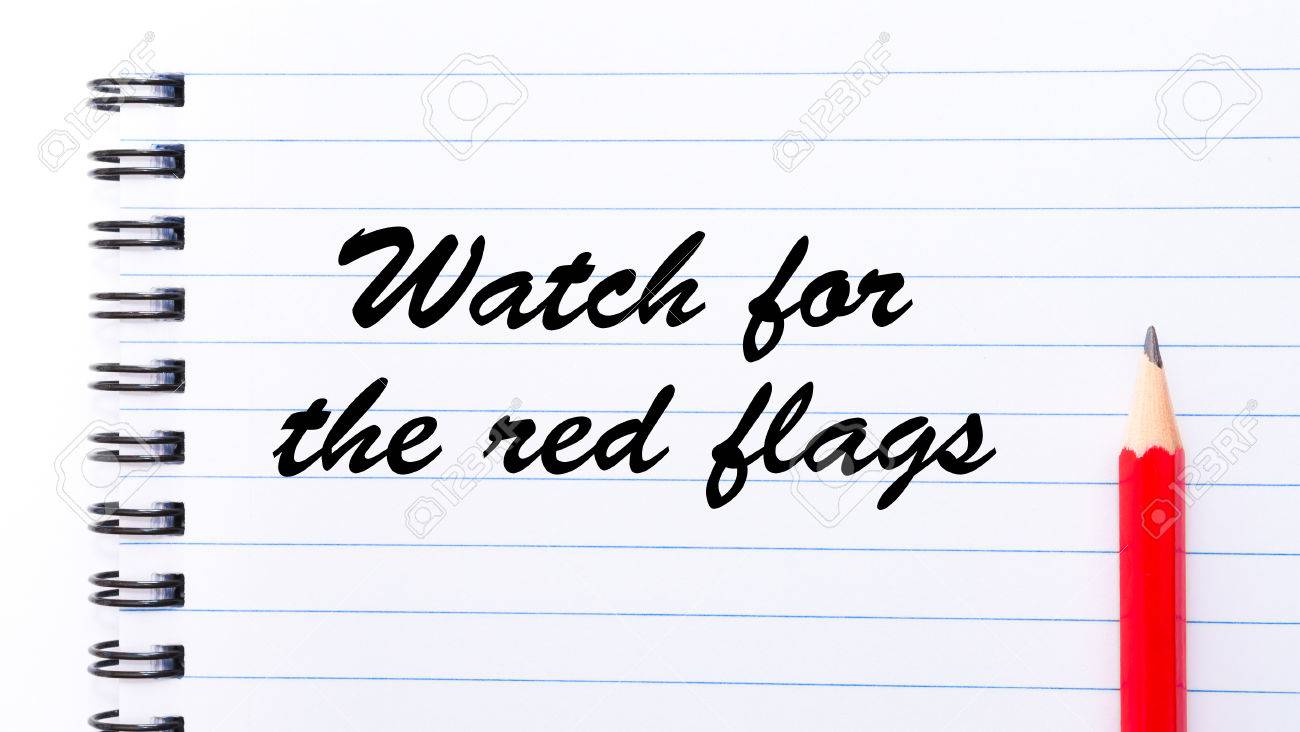 watch for the red flags written on notebook page red pencil stock