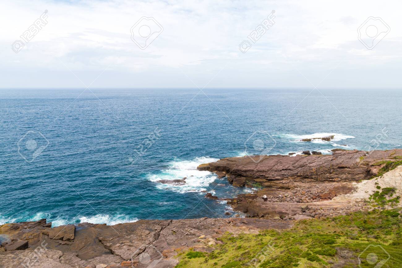 View Over Remote Green Cape Headland Coastline Located In Ben
