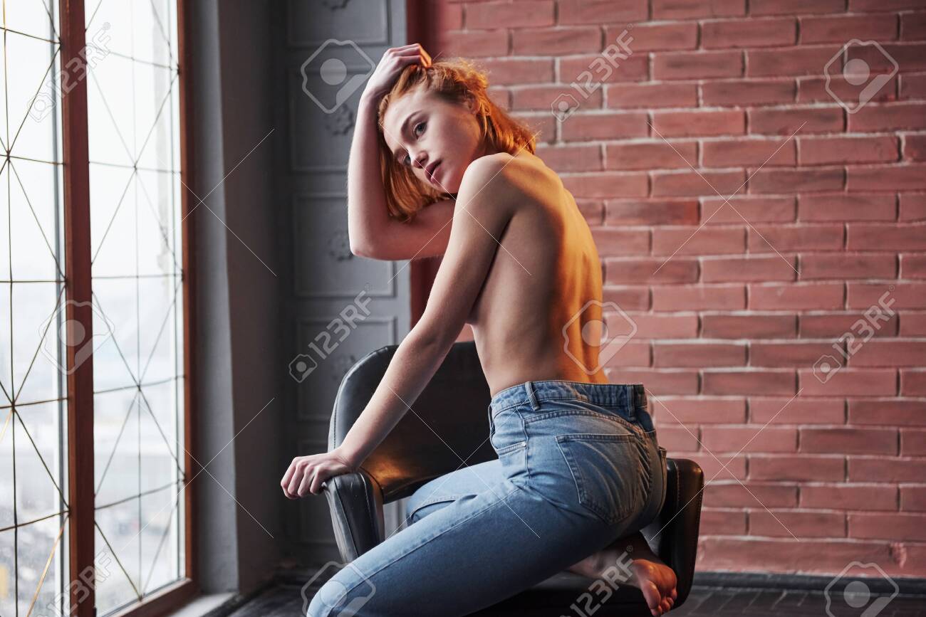 Naked Women Looking Behind Her