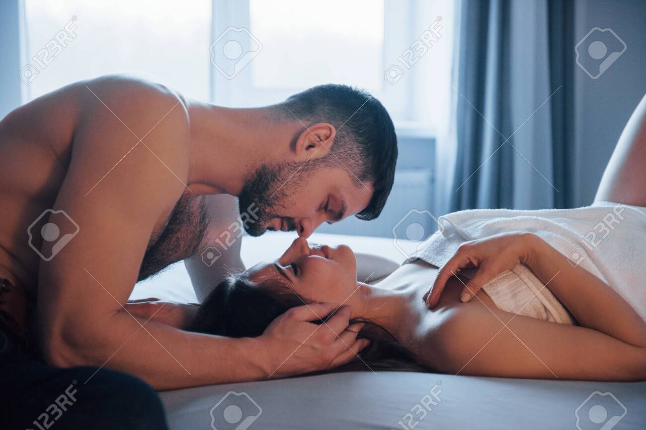 Young And Happy. Sexy Couple Lying On The Bed And Enjoying Themselves At  Morning Time. Stock Photo, Picture and Royalty Free Image. Image 135310218.