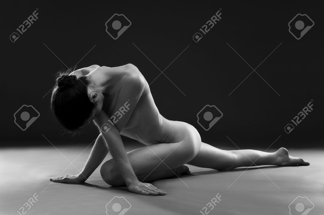Naked Yoga. Beautiful Sexy Body Of Young Woman On Gray Background. Low Key  Black And White Studio Photography Stock Photo, Picture and Royalty Free  Image. Image 48758509.