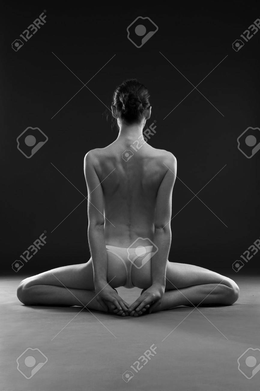 Naked Yoga. Beautiful Sexy Body Of Young Woman On Gray Background. Low Key  Black And White Studio Photography Stock Photo, Picture and Royalty Free  Image. Image 53553859.