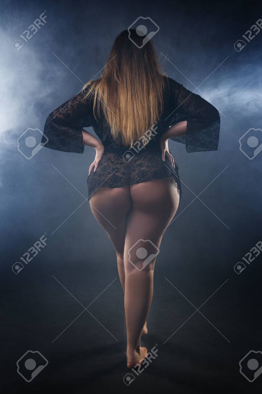 Young Naked Beautiful Caucasian Plus Size Model, Xxl Woman In Black  Peignoir On Smoky Studio Background, Beauty Female Nude Body With Big  Buttocks And Hips Stock Photo, Picture and Royalty Free Image.