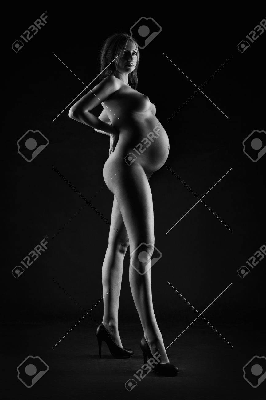 Sexy Pregnant Nude Art - Beautiful naked pregnant woman on black studio background, pregnancy..