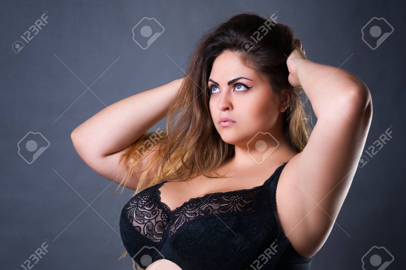 Plus Size Sexy Model In Black Bra, Fat Woman With Big Natural Breast On  Gray Studio Background, Overweight Female Body, Long Hair And Make-up Stock  Photo, Picture and Royalty Free Image. Image