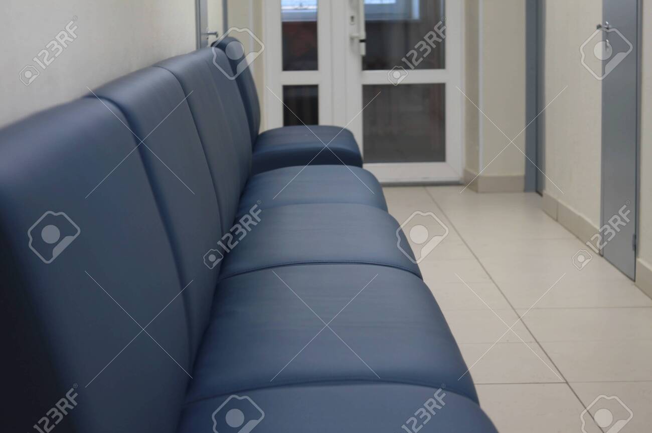 Leather Black Sofa In An Empty Long Corridor With Doors Concept Stock Photo Picture And Royalty Free Image Image 140992074