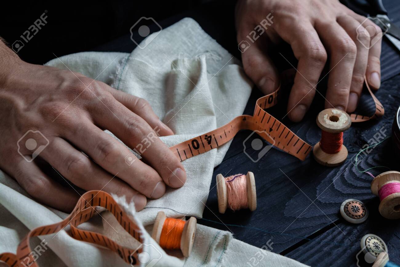 Male tailoring, sewing close up hands, craftsman - 120709798 Male tailoring, sewing close up hands, craftsman - 120709798