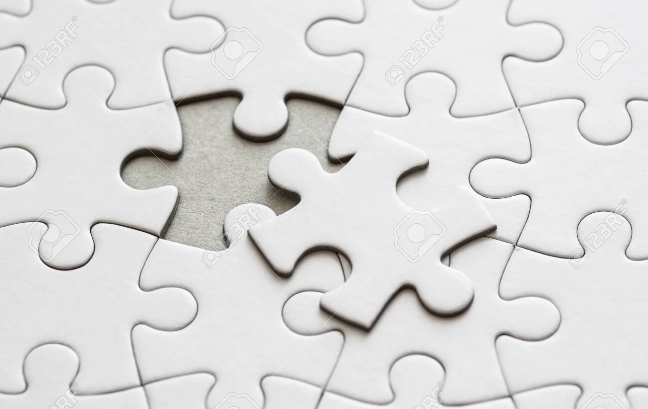 Close Up On Blank, White Jigsaw Puzzle Pieces. One Piece Is Removed, To The  Side Stock Photo, Picture and Royalty Free Image. Image 140669821.