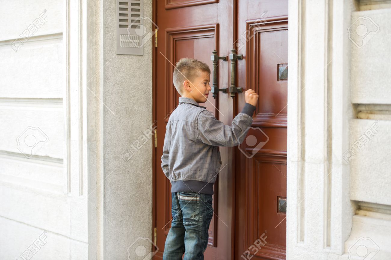 Little Boy Knocking The Door Stock Photo, Picture And Royalty Free - 1300x865 - jpeg Knocking On The Door