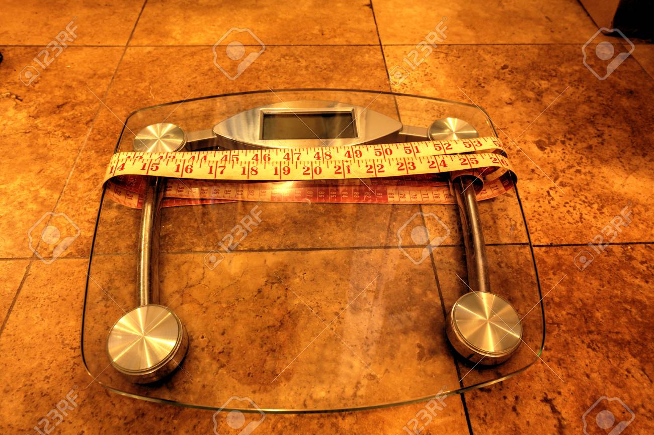 scale to monitor weight with a measuring tape to take measurements
