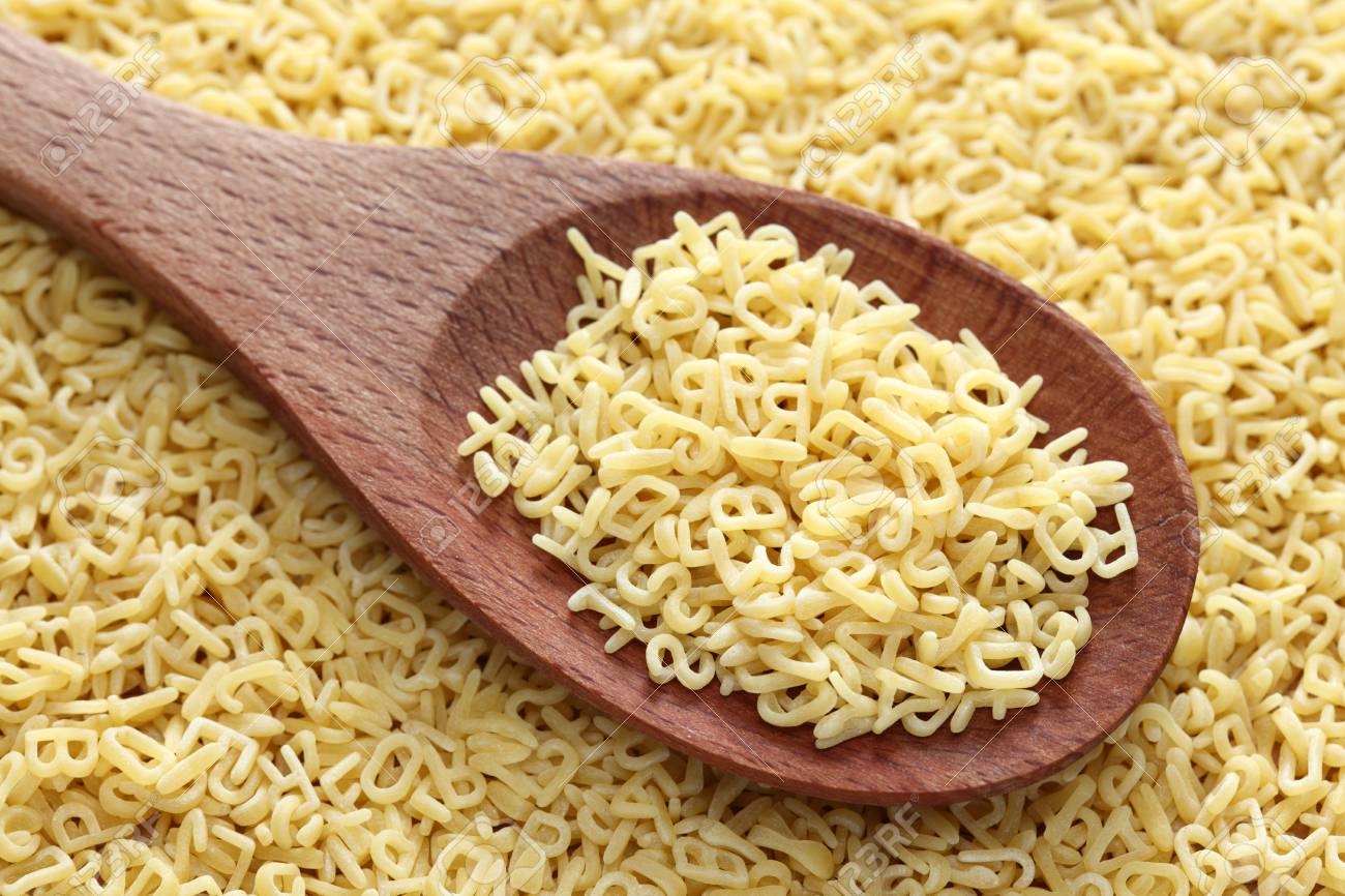 Raw Alphabet Soup Pasta In A Wooden Spoon On A Alphabet Soup Pasta Background Close Up Stock Photo Picture And Royalty Free Image Image 35091414