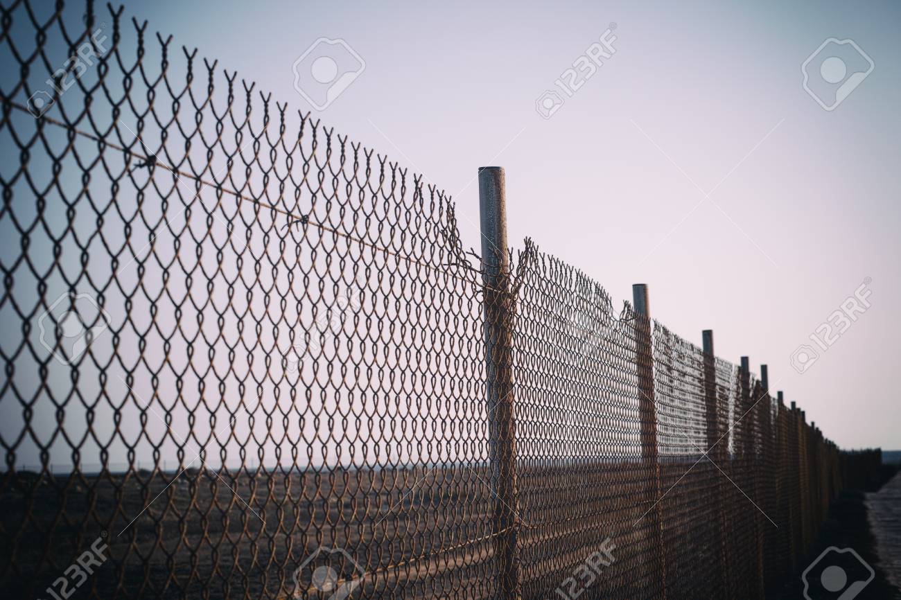 Old Rust Chain Link Fence. Vignette. Stock Photo, Picture and Royalty Free  Image. Image 65774766.