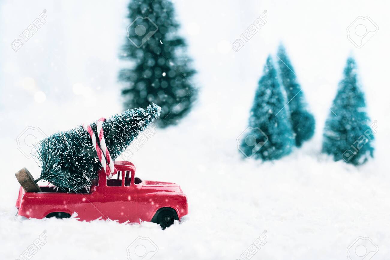red toy truck with christmas tree