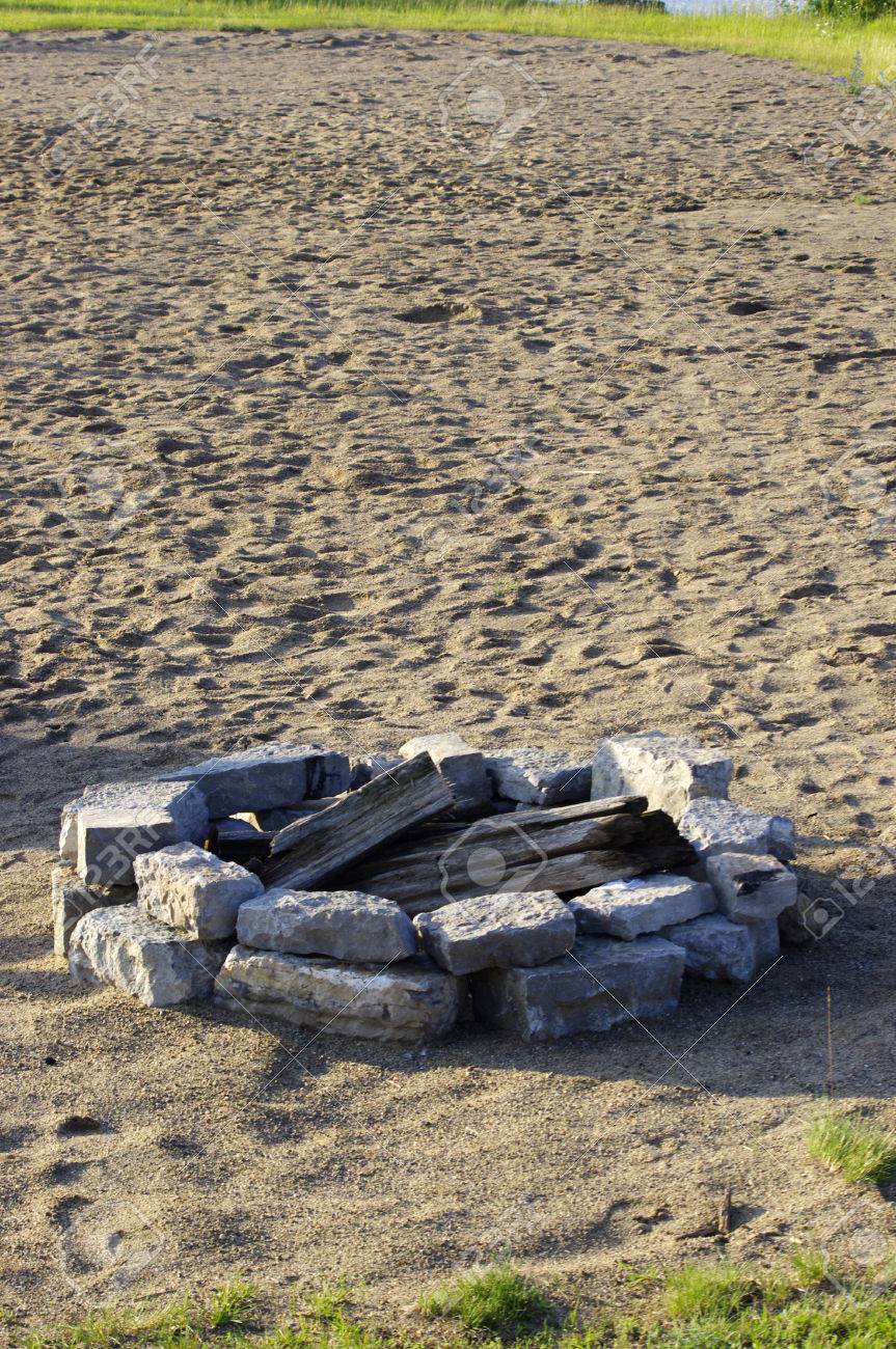 Rock Camp Fire Pit On Sandy Beach With Copy Space Stock Photo