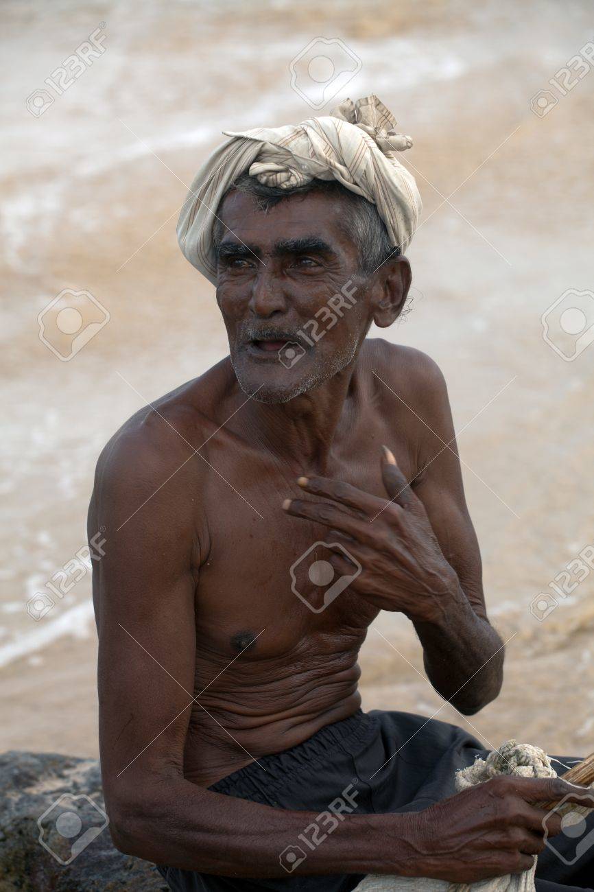 Portrait: the old man from sri lanka sits on the shore of the ocean - 10317560 Portrait: the old man from sri lanka sits on the shore of the ocean - 10317560