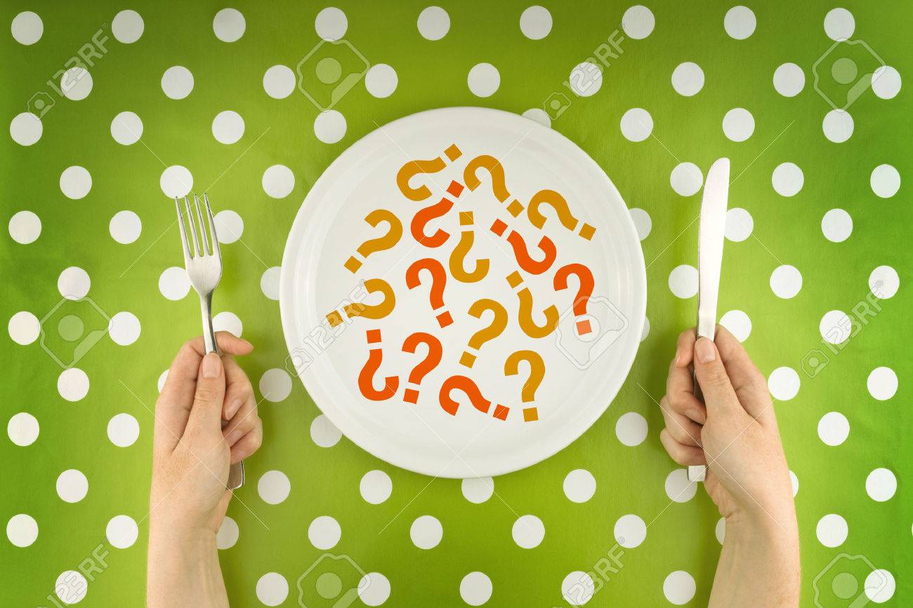 Woman eating question marks on a white plate, top view. Unknown or unredcognizable food concept. - 32149240 Woman eating question marks on a white plate, top view. Unknown or unredcognizable food concept. - 32149240