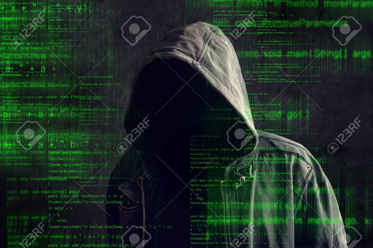 Faceless hooded anonymous computer hacker with programming code from monitor - 33042321 Faceless hooded anonymous computer hacker with programming code from monitor - 33042321