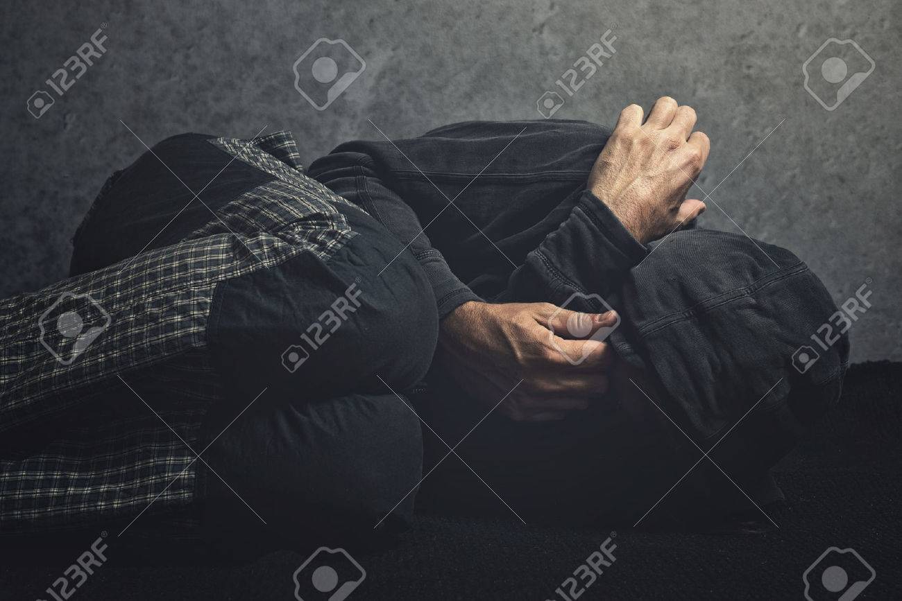 Drug Addict laying on the floor in agony, having an addiction crisis - 33150968 Drug Addict laying on the floor in agony, having an addiction crisis - 33150968