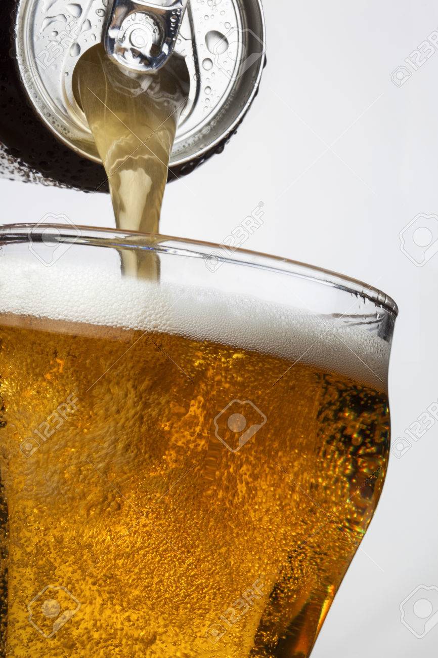 pouring ice cool beer from a ring pull can stock photo picture and