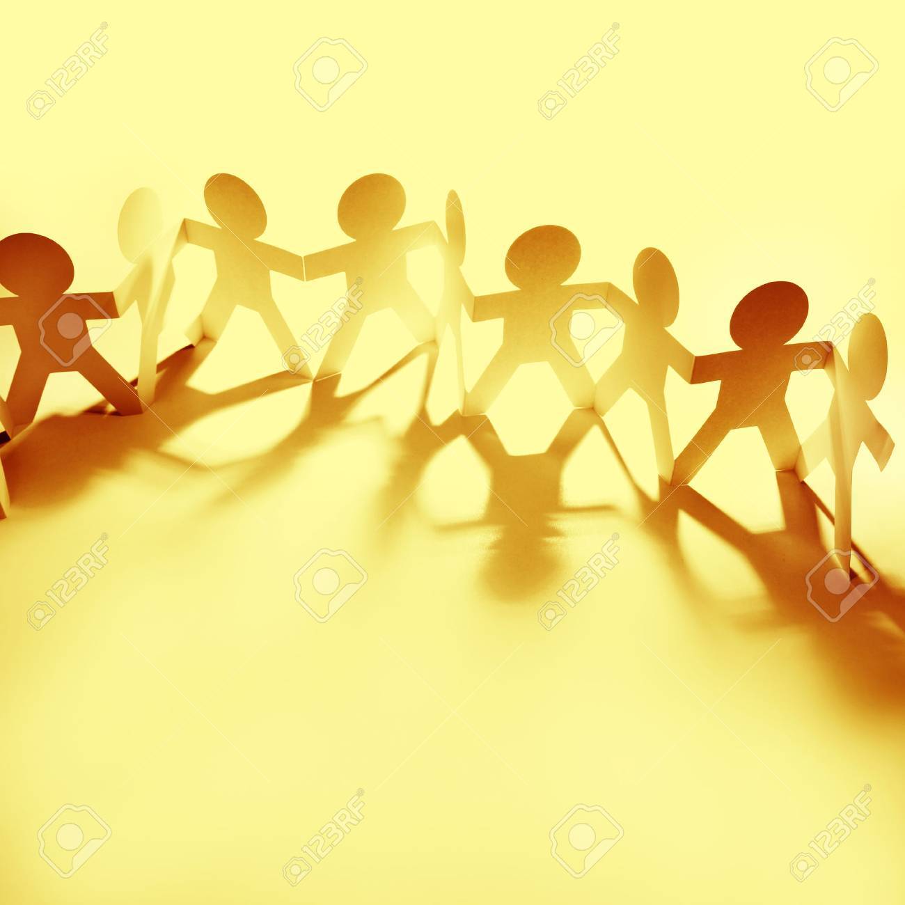 Team Of Paper Doll People Holding Hands Stock Photo Picture And Team Of Paper Doll People Holding Hands Stock Photo Picture And