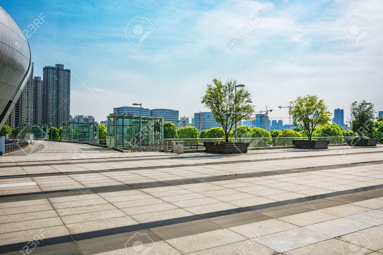 Long Empty Footpath In Modern City Square With Skyline. Фотография,  картинки, изображения и сток-фотография без роялти. Image 81790271