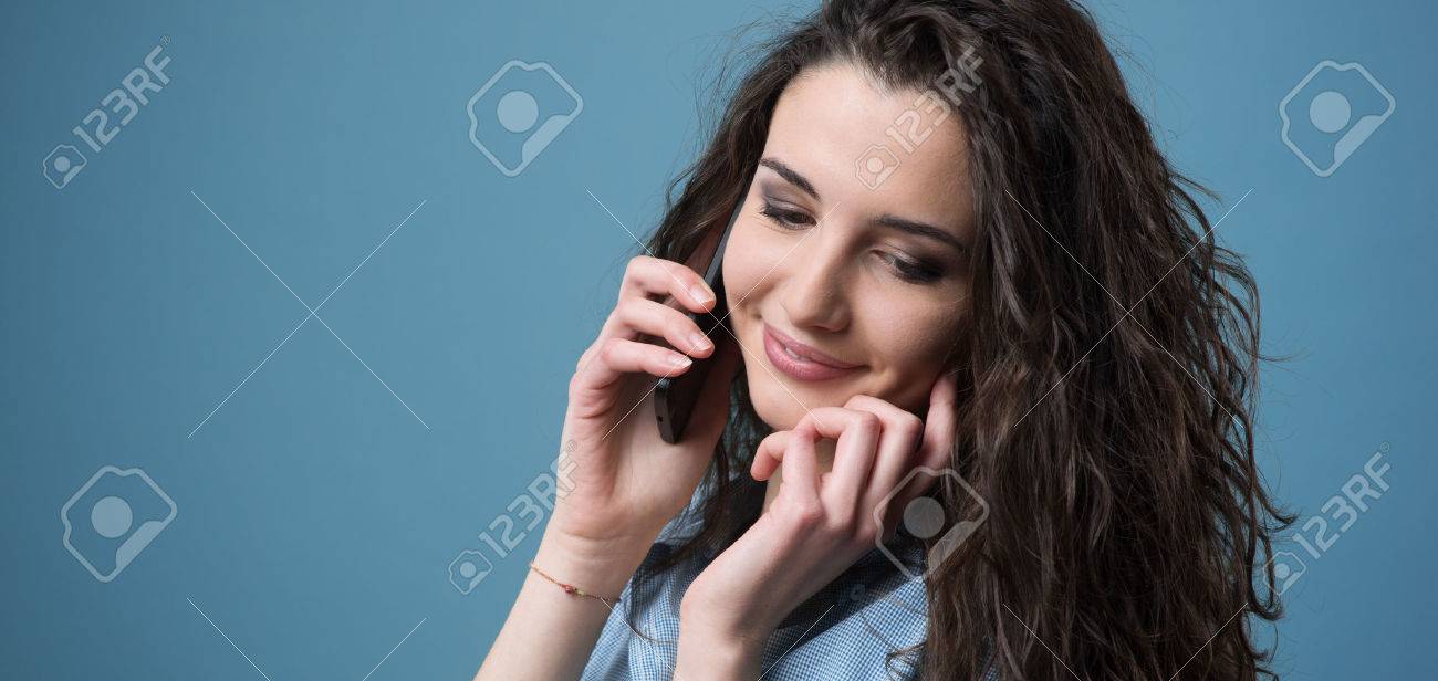 cute girl having a phone call with her smart phone and touching phone girl