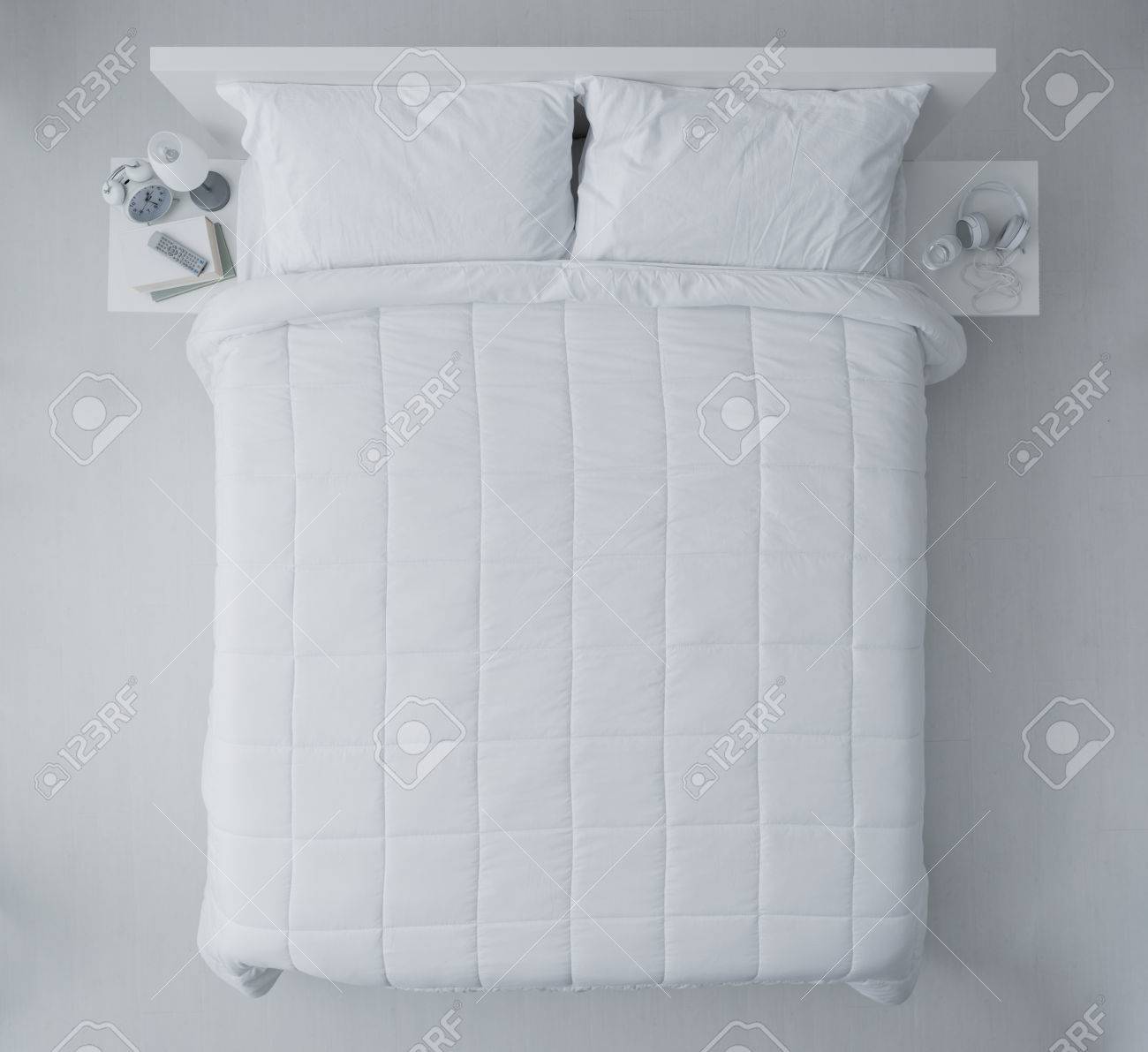 elegant bedroom with white duvet and sheets top view stock photo elegant sheets