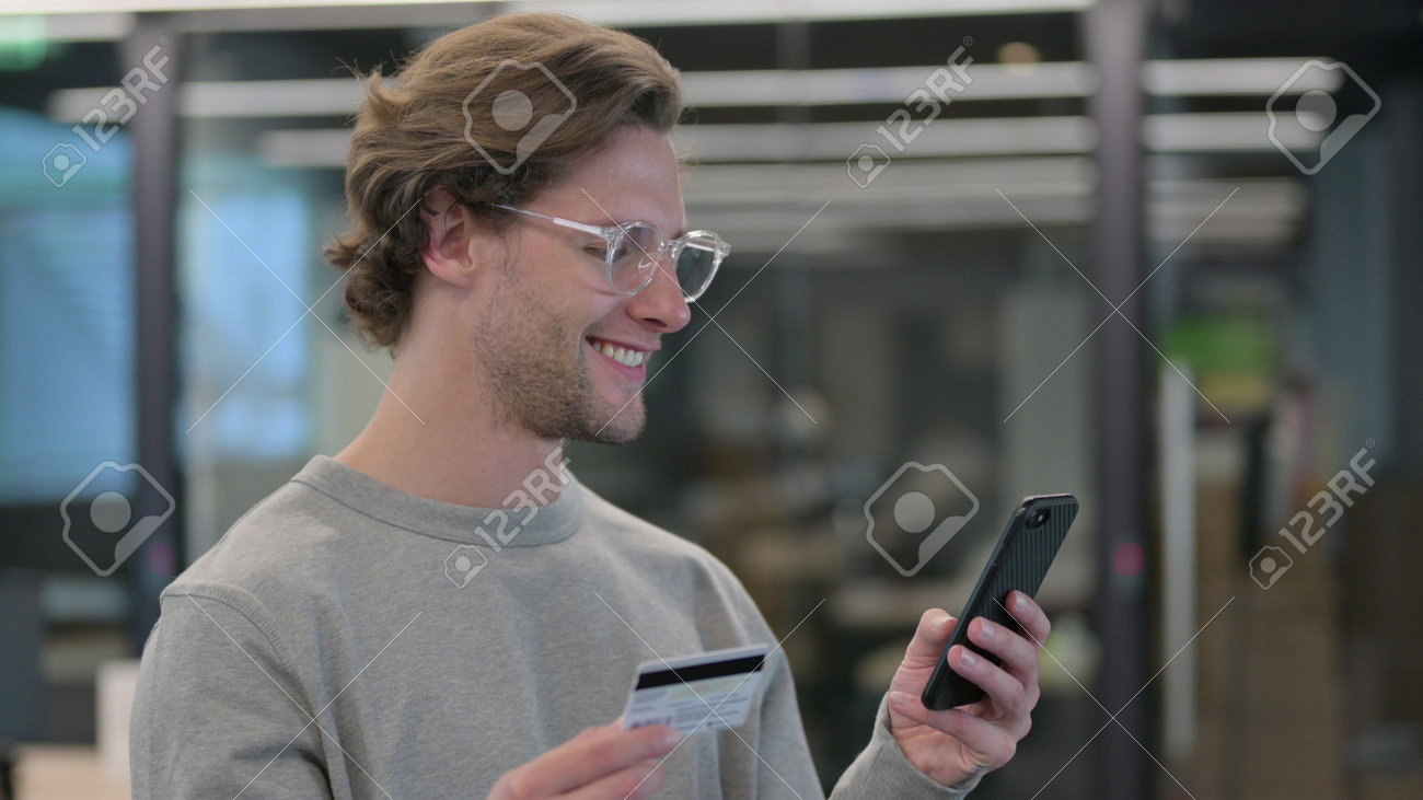 Portrait of Young Man Doing Online Shopping on Smartphone - 172194951 Portrait of Young Man Doing Online Shopping on Smartphone - 172194951
