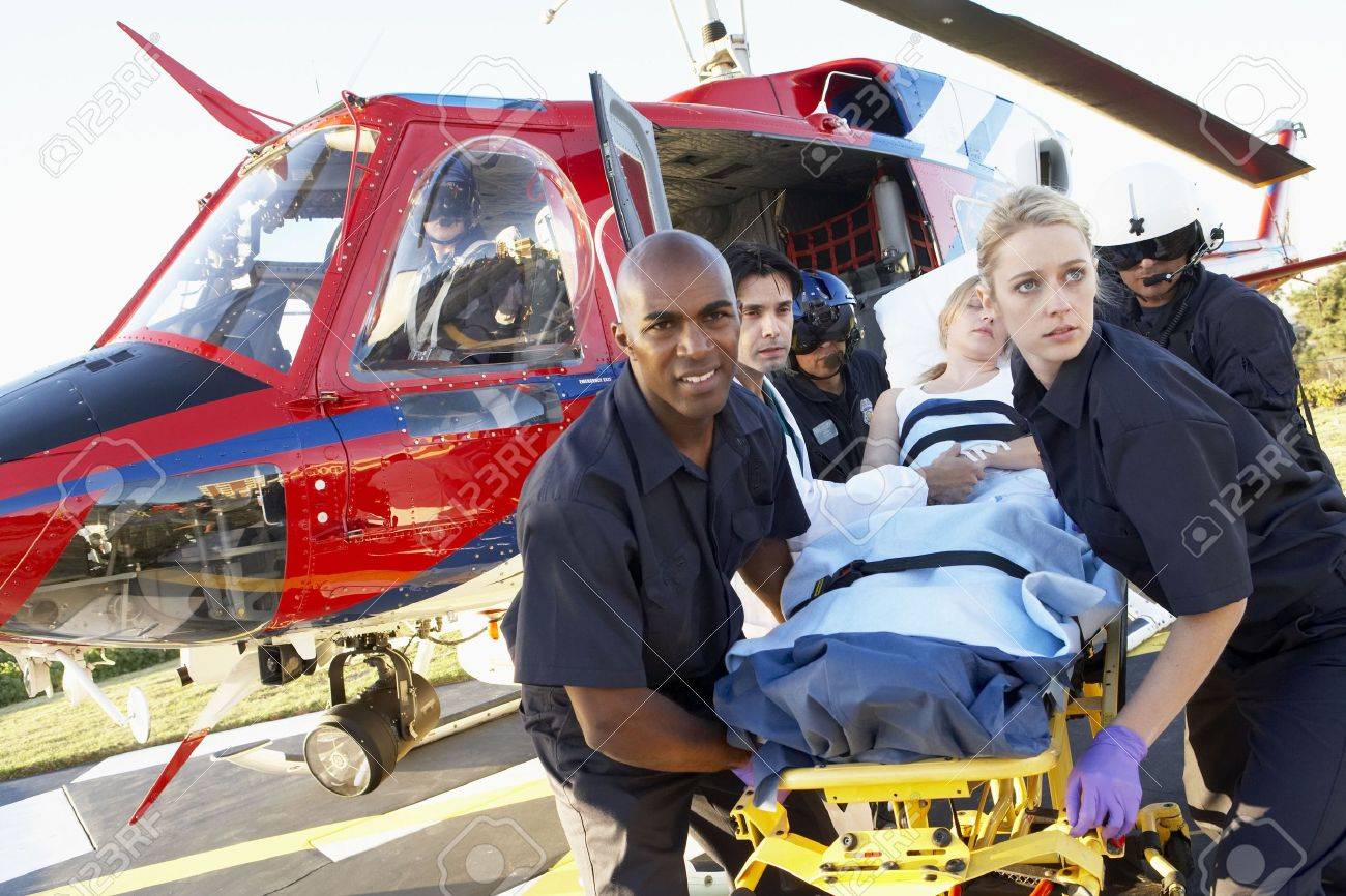 Paramedics unloading patient from Medevac - 4607756 Paramedics unloading patient from Medevac - 4607756
