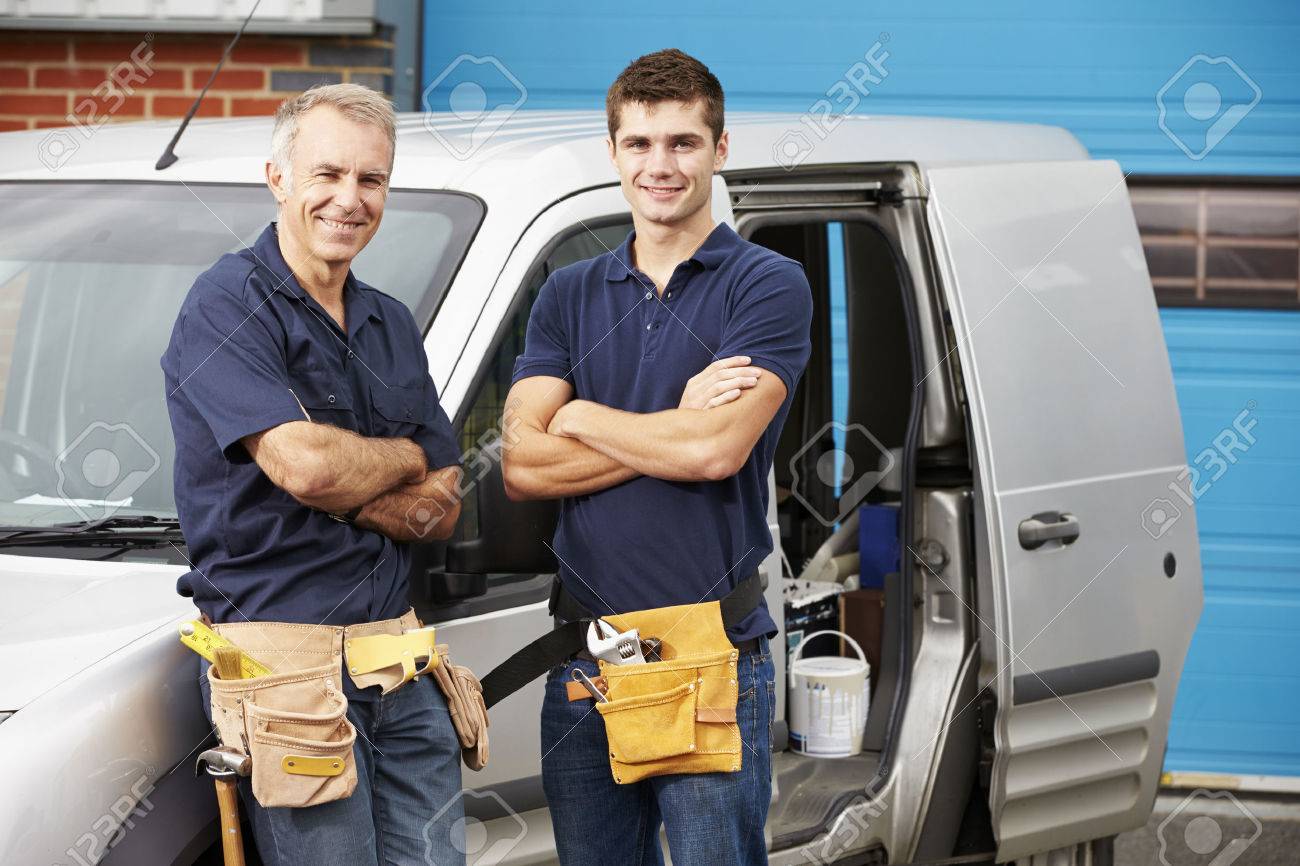 Workers In Family Business Standing Next To Van - 31009971 Workers In Family Business Standing Next To Van - 31009971