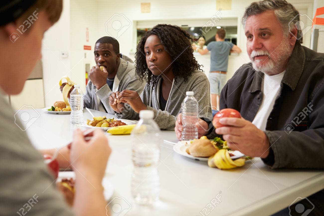People Sitting At Table Eating Food In Homeless Shelter Stock Photo Picture And Royalty Free Image Image