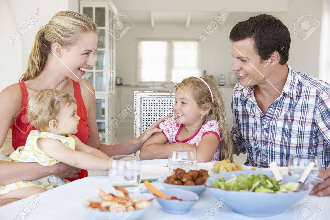 Family Enjoying Meal Together At Home - 41492705 Family Enjoying Meal Together At Home - 41492705