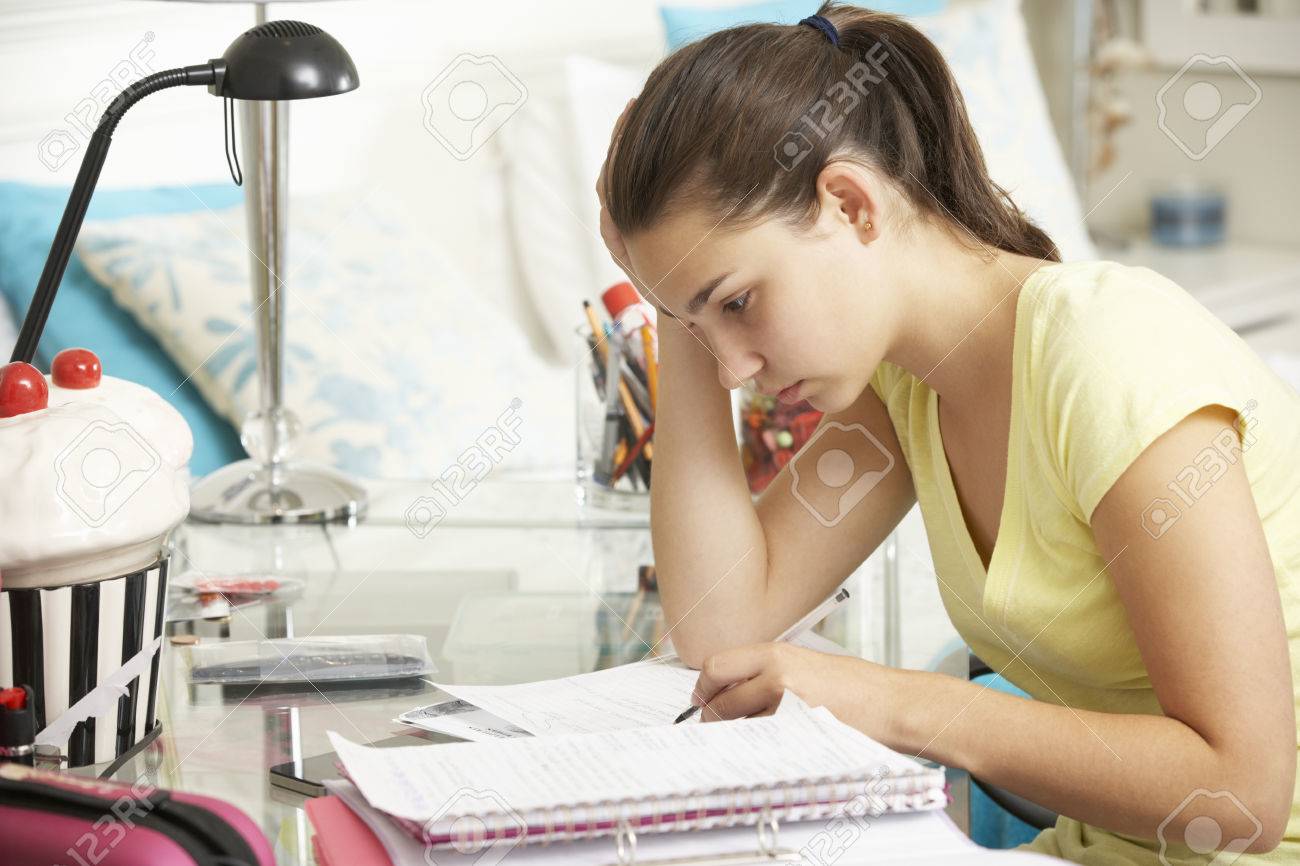 https://previews.123rf.com/images/stockbroker/stockbroker1507/stockbroker150702587/42163839-teenage-girl-studying-at-desk-in-bedroom.jpg?utm_source=chatgpt.com