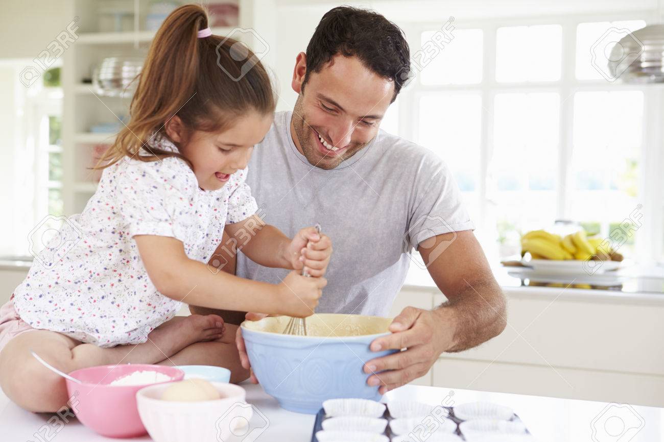 father and daughter baking