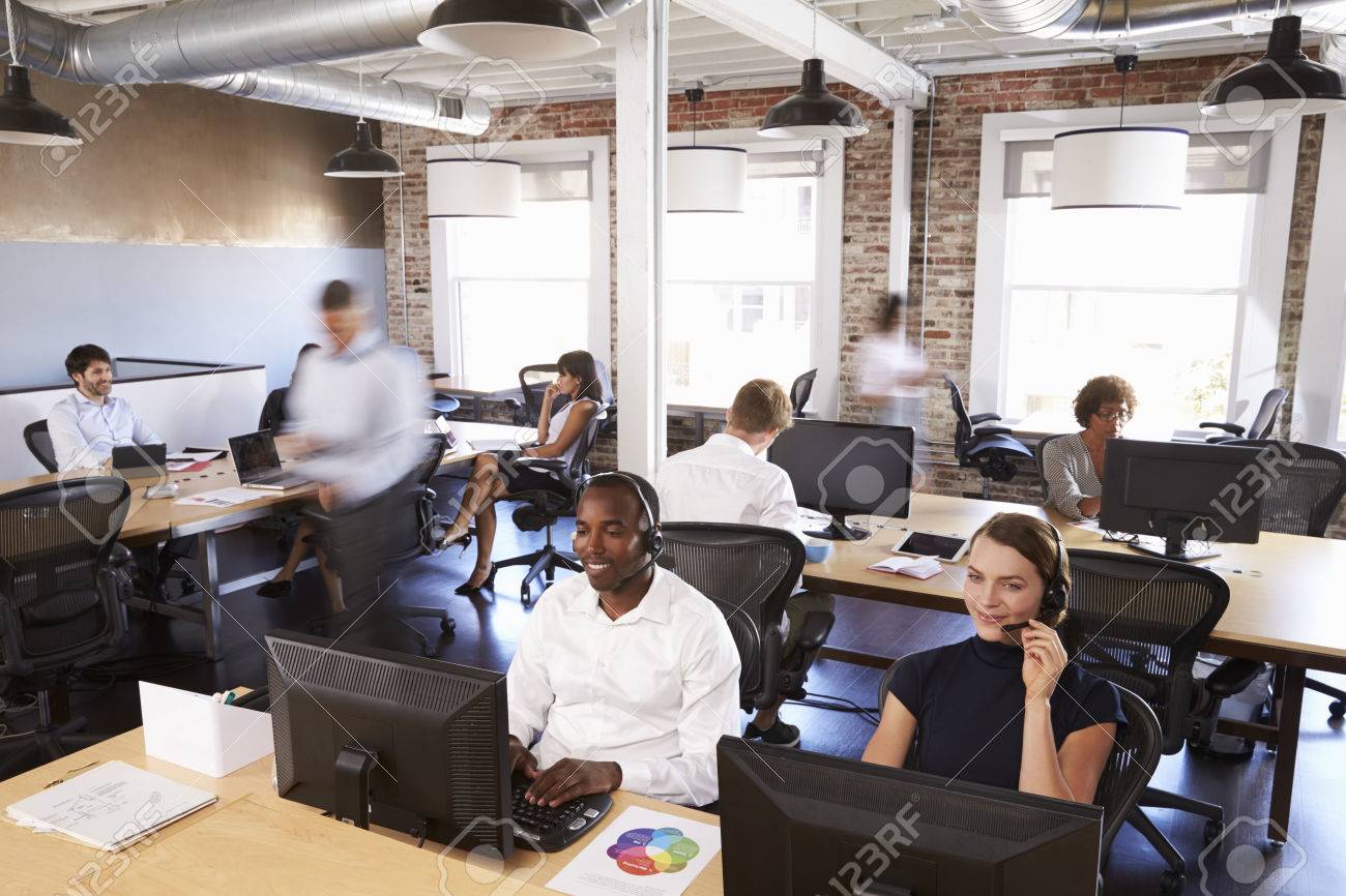 View Of Staff In Busy Customer Service Department - 71279201 View Of Staff In Busy Customer Service Department - 71279201