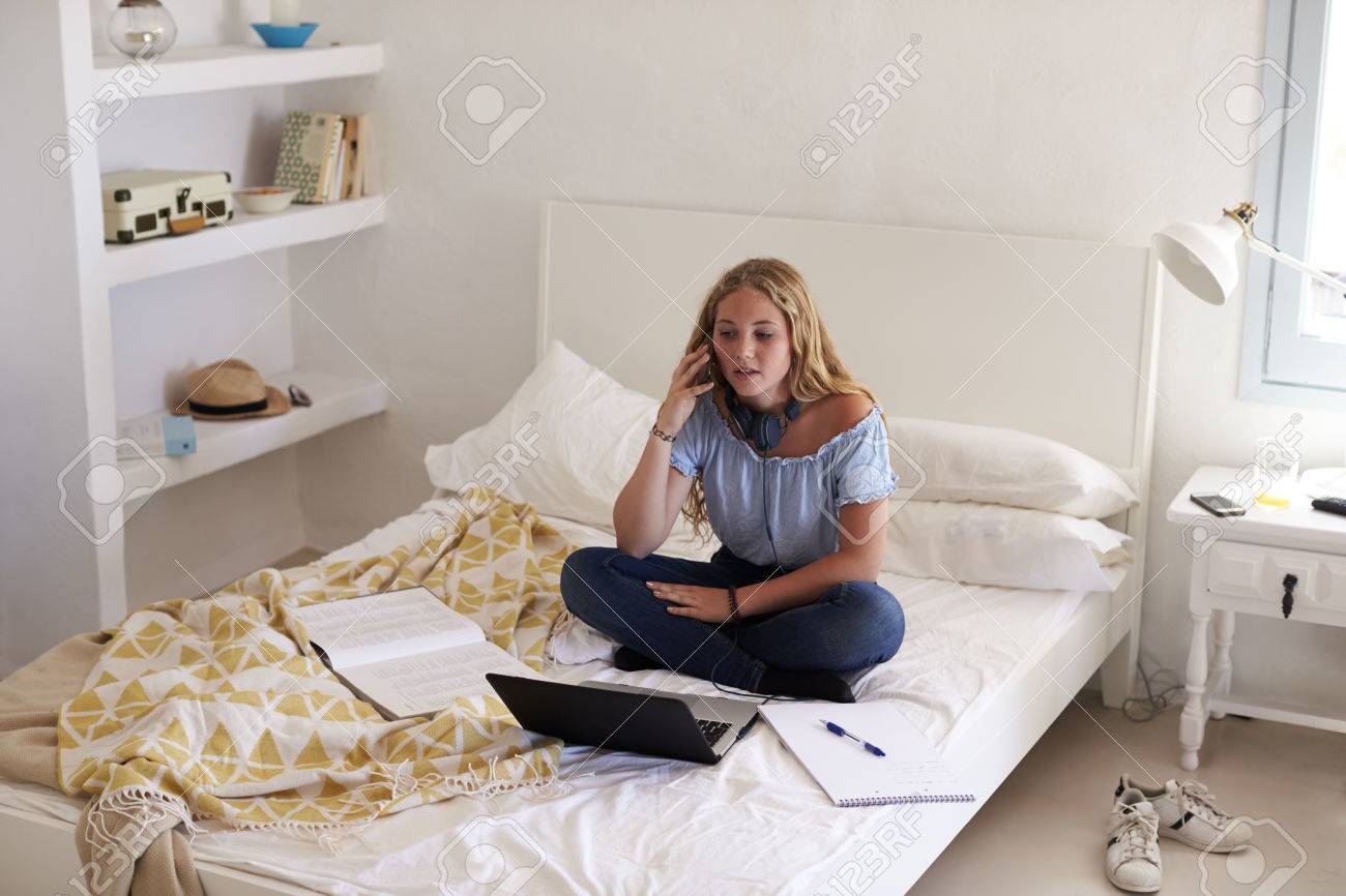 doing homework on your bed