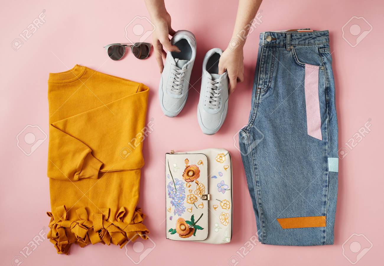 Hands Arranging Flat Lay Shot Of Female Autumn Clothing - 85441049 Hands Arranging Flat Lay Shot Of Female Autumn Clothing - 85441049