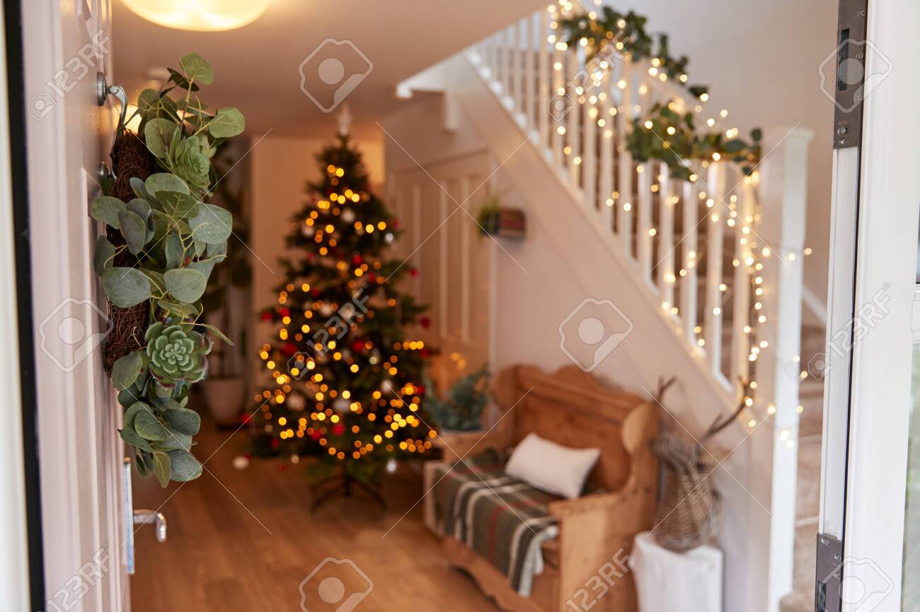 Hallway Of Home Decorated For Christmas Viewed Through Front Door - 133248620 Hallway Of Home Decorated For Christmas Viewed Through Front Door - 133248620