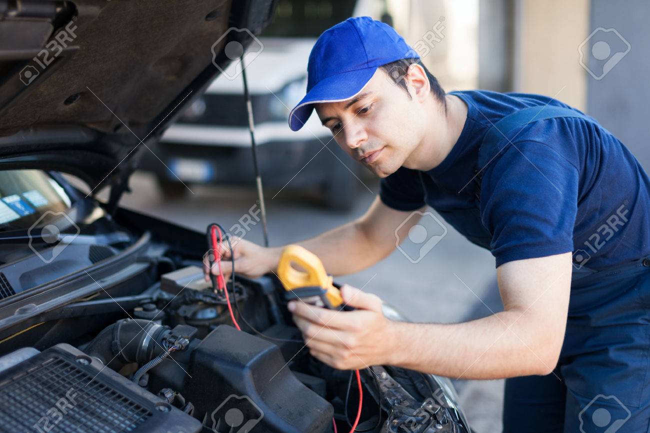 auto electrician troubleshooting a car engine stock photo picture automotive electrician