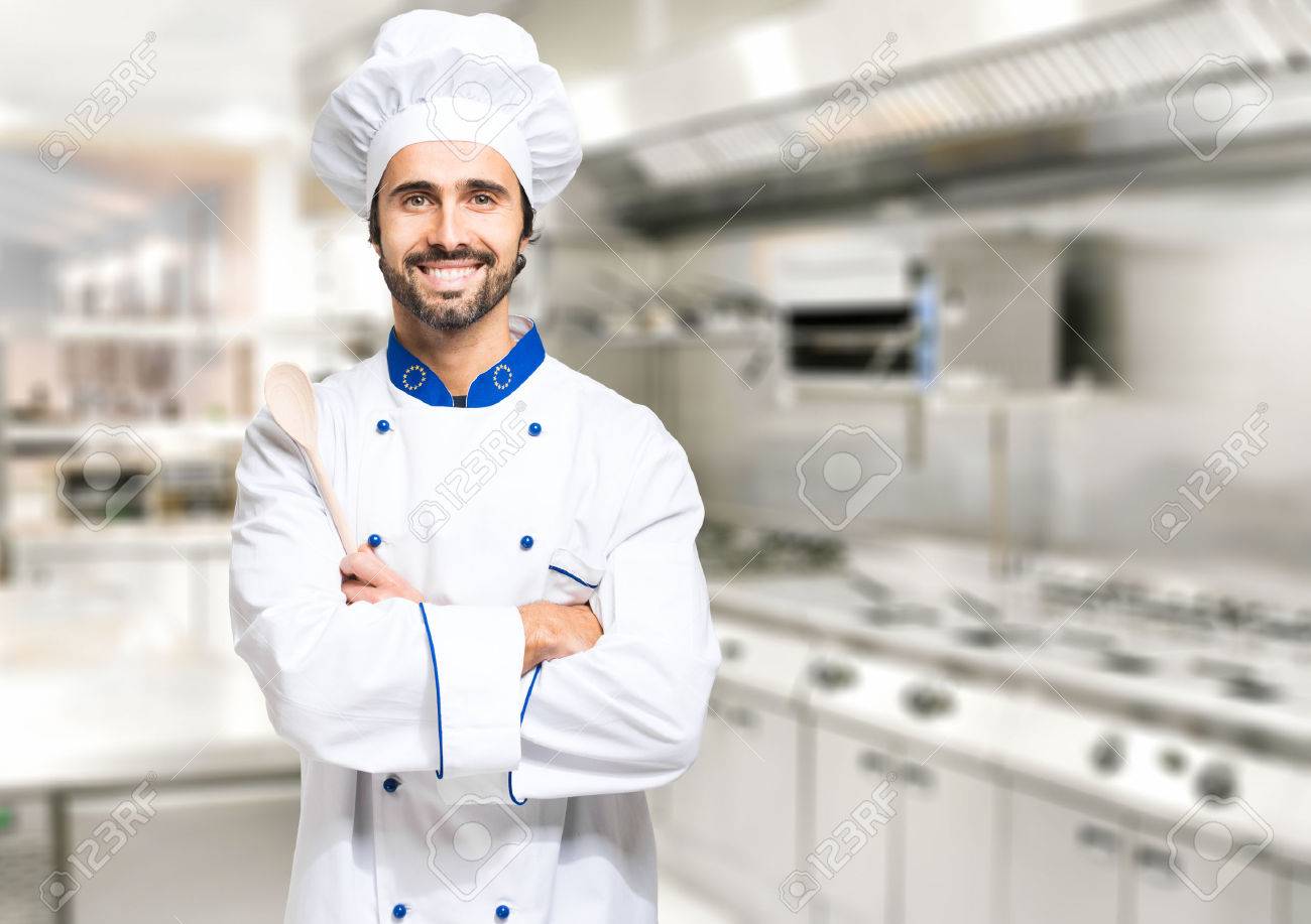 smiling chef in his kitchen stock photo picture and royalty free