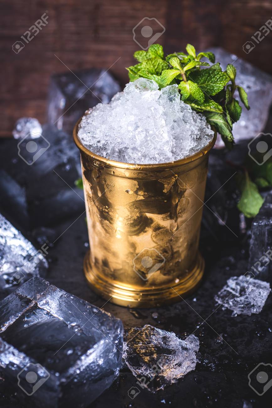 The ice in the tin can is decorated with mint. - 92863990 The ice in the tin can is decorated with mint. - 92863990